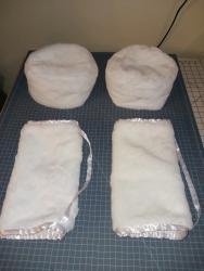 Picture of two cossack style winter caps and hand muffs